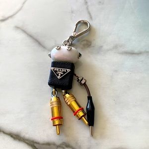 Prada keychain with one missing arm